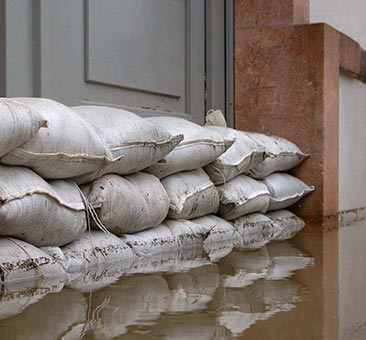 Sandbags preventing water from entering a home