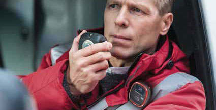 First responder with Solo detector clipped to the front of jacket